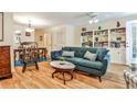 Bright living room features hardwood floors, a built-in bookcase, and a cozy sofa for relaxation at 1750 Clairmont Rd # 35, Decatur, GA 30033