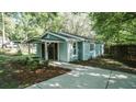 Home featuring a covered front porch, concrete walkway, and side yard landscaping at 4443 Toonigh Nw Rd, Acworth, GA 30101