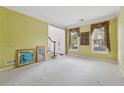 Living room boasts neutral carpet and large windows at 5013 Kendall Nw Sta, Acworth, GA 30102