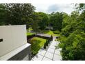 An aerial view showcases the home's manicured yard, driveway, and surrounding neighborhood at 1099 Vista Ne Trl, Atlanta, GA 30324