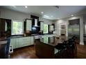 Open kitchen with modern cabinetry, a center island, and stainless steel appliances at 1099 Vista Ne Trl, Atlanta, GA 30324