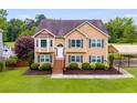 Charming two-story home with manicured lawn and ample parking at 638 Oberlochen Way, Douglasville, GA 30134