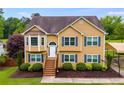 Charming two-story home with manicured lawn and ample parking at 638 Oberlochen Way, Douglasville, GA 30134