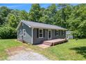 Charming single-story home with a well-maintained lawn and a cozy front porch at 130 Driver St, Temple, GA 30179