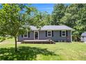 Charming single-story home with a well-maintained lawn and a cozy front porch at 130 Driver St, Temple, GA 30179