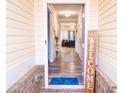 Inviting foyer featuring wood floors, neutral walls, and a glimpse of the living area at 1431 Beckett Dr, Hampton, GA 30228
