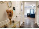 Elegant hallway with console table and decor, leading to the living areas at 1431 Beckett Dr, Hampton, GA 30228