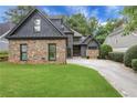 Beautiful craftsman-style home with stone accents, manicured lawn and mature landscaping at 2255 Lenox Ridge Ne Ct, Atlanta, GA 30319