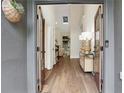View through the double front doors to a hardwood floor and an open concept living area at 2255 Lenox Ridge Ne Ct, Atlanta, GA 30319