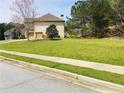 Spacious, well-maintained lawn, perfect for outdoor activities at 533 Mount Gerizim Se Rd, Mableton, GA 30126