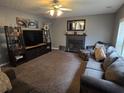 Spacious living room with fireplace and comfortable seating area at 5578 Swanson Rd, Ellenwood, GA 30294