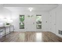 Bright entryway featuring hardwood floors and neutral paint at 402 Roswell Green Ln, Roswell, GA 30075