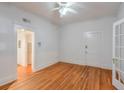 Bright bedroom with hardwood floors, white trim, and a ceiling fan at , Atlanta, GA 30306