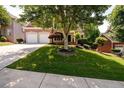 Beautiful brick home with a two-car garage and a meticulously maintained lawn and front yard at 2484 Mossy Branch Dr, Snellville, GA 30078