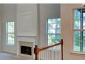 Close-up of the fireplace in the living room, showcasing its detailed mantel and design at 514 Jadetree Ln, Atlanta, GA 30349