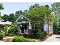 Beautiful two-story home featuring a cozy front porch and a well-maintained yard at 132 Olympic Pl, Decatur, GA 30030