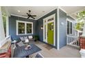 Cozy front porch with seating and a swing, perfect for relaxing outdoors at 132 Olympic Pl, Decatur, GA 30030