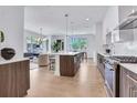 Bright, open kitchen with stainless steel appliances and a large center island at 775 Juniper Ne St # 327, Atlanta, GA 30308