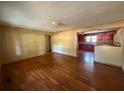Open living space featuring hardwood floors and an opening into the kitchen at 1272 Cave Springs Rd, Douglasville, GA 30134