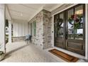 Inviting front porch with stone accents, double doors, and charming decorative wreaths at 2996 Treeside Ter, Marietta, GA 30066