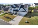 Two-story home with a two car garage and a large back yard at 55 Clubhouse Way, Acworth, GA 30101
