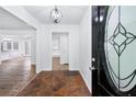 Inviting foyer with stone tile flooring and decorative glass front door at 3210 Roseheath Ln, Lithonia, GA 30038
