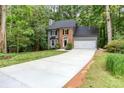 Beautifully landscaped home with a well-maintained front lawn and long driveway at 4806 Deer Chase, Powder Springs, GA 30127