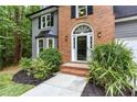 Close-up of the front entrance, showcasing the beautiful door and landscaping at 4806 Deer Chase, Powder Springs, GA 30127