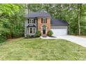 Beautiful two-story home with manicured lawn, black shutters, and a brick entryway at 4806 Deer Chase, Powder Springs, GA 30127