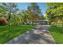 Inviting home with a spacious front yard and long driveway at 512 Plantation Blvd, Lawrenceville, GA 30046