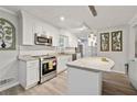 Modern kitchen with granite countertops, stainless steel appliances, and an island at 512 Plantation Blvd, Lawrenceville, GA 30046