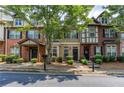 Street view of cozy townhomes with well-kept lawns and trees, showcasing a welcoming neighborhood at 529 Ridge View Crossing Xing, Woodstock, GA 30188
