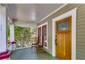 View of the front porch featuring a wooden front door with art deco window panes at 1405 May Se Ave, Atlanta, GA 30316