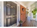 Close-up of the front door showcasing its design and the house number at 4610 Admiral Ridge Way, Lilburn, GA 30047