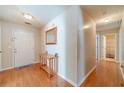 Welcoming foyer with hardwood floors, a mirror, and a decorative table, setting an elegant tone at 704 Stonecrest Ln, Loganville, GA 30052