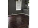 Cozy area with dark hardwood floors and a large window bringing in natural light at 836 Wood Nw St, Atlanta, GA 30318