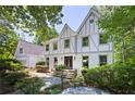 Charming two-story home featuring a well-manicured front yard and a brick exterior at 55 Bransford Rd, Sandy Springs, GA 30324