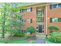 Traditional brick building with a garden and black window shutters at 1111 Clairemont Ave # N3, Decatur, GA 30030