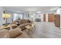 Bright living room featuring hardwood floors and large windows, offering ample natural light at 1111 Clairemont Ave # N3, Decatur, GA 30030