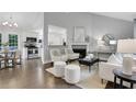 Open-concept living room with fireplace and seamless flow to dining area at 756 Joseph E Lowery Sw Blvd, Atlanta, GA 30310