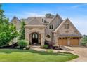 Beautifully landscaped home with a striking stone and shingle facade, plus an attached two-car garage at 89 Somerset Ln, Cartersville, GA 30121