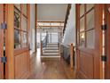 Grand foyer with hardwood floors, a staircase, and exposed beams, creating an open and inviting entrance at 89 Somerset Ln, Cartersville, GA 30121