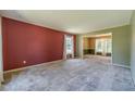 Spacious living room featuring neutral carpet and a window with natural light streaming in at 5166 Vivid Dr, Stone Mountain, GA 30087