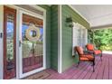 Inviting front porch featuring comfortable seating and a charming exterior view at 940 Planters Pl, Loganville, GA 30052