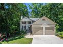 Charming two-story home featuring a two-car garage, well-manicured lawn, and a welcoming front porch at 3006 Durban Ct, Decatur, GA 30034