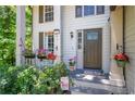 Inviting front porch with colorful flower baskets and a 'Welcome' sign at 3006 Durban Ct, Decatur, GA 30034