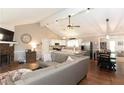 Inviting living room with a stone fireplace, vaulted ceiling, and an open floor plan at 510 Whistlestop Dr, Woodstock, GA 30189