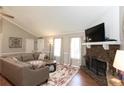 Relaxing living room showcases a stone fireplace and open layout at 510 Whistlestop Dr, Woodstock, GA 30189