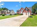 Lovely two-story brick home with a spacious driveway and well-kept front lawn at 5125 Winding Glen Dr, Lithonia, GA 30038