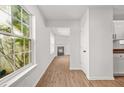 Bright living room features hardwood floors, a cozy fireplace, and large windows for natural light at 3454 Carriage Chase Rd, Atlanta, GA 30349